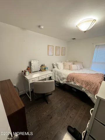a bedroom with a bed and a table in it
