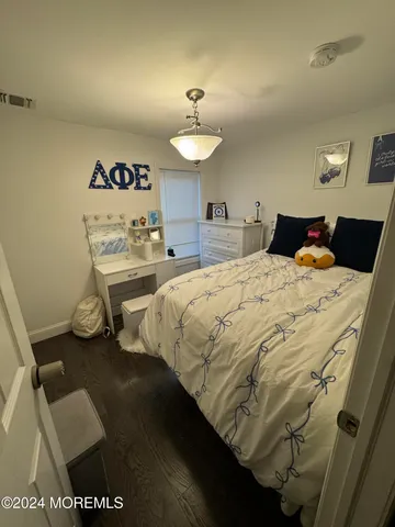 a bedroom with a bed and a table