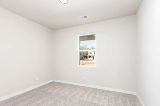 a view of an empty room and window