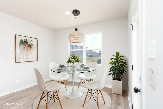 a dining room with furniture and window