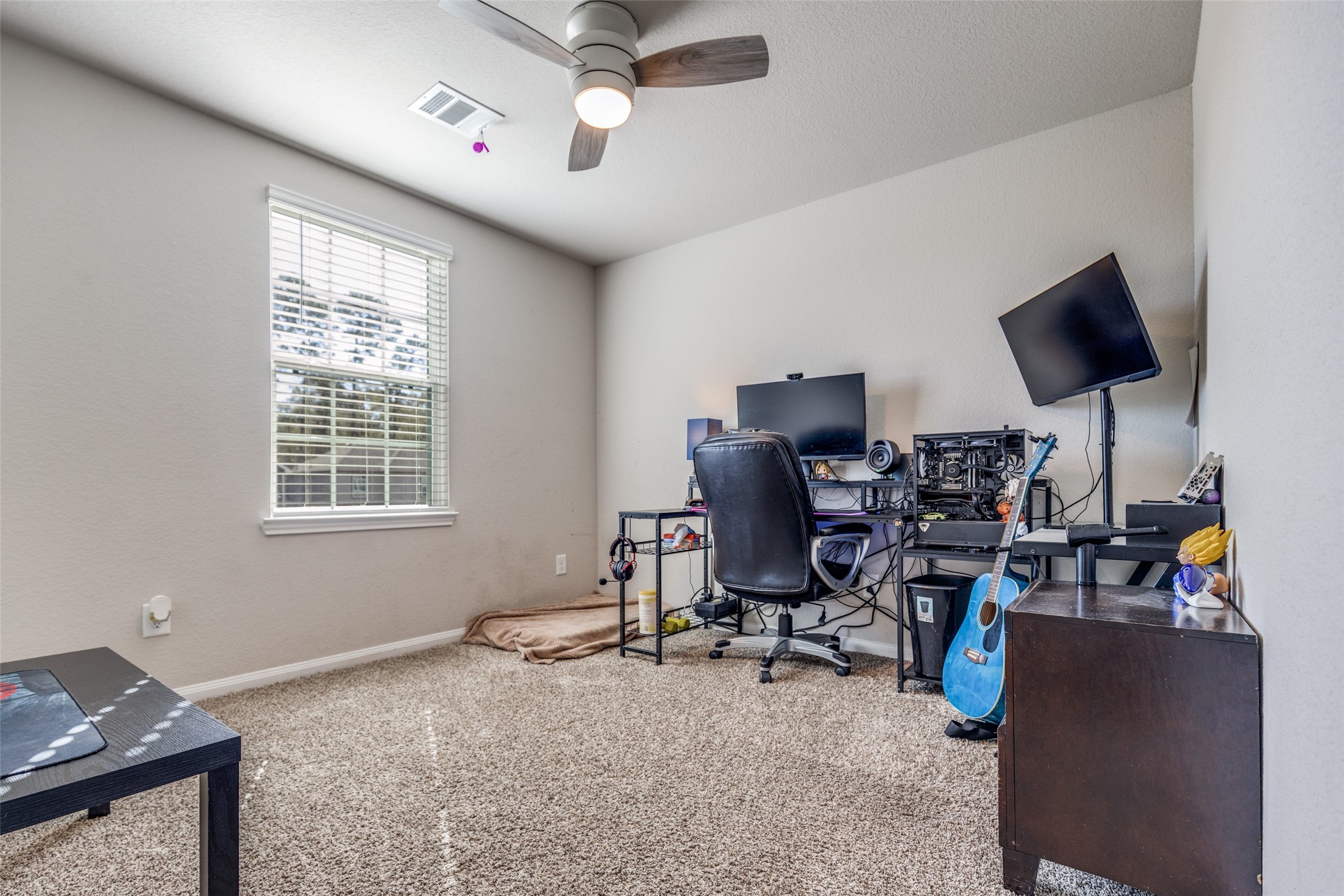 3633 Cub Drive Conroe, TX 77301 - Photo 11 of 30 a view of a workspace with furniture and a window