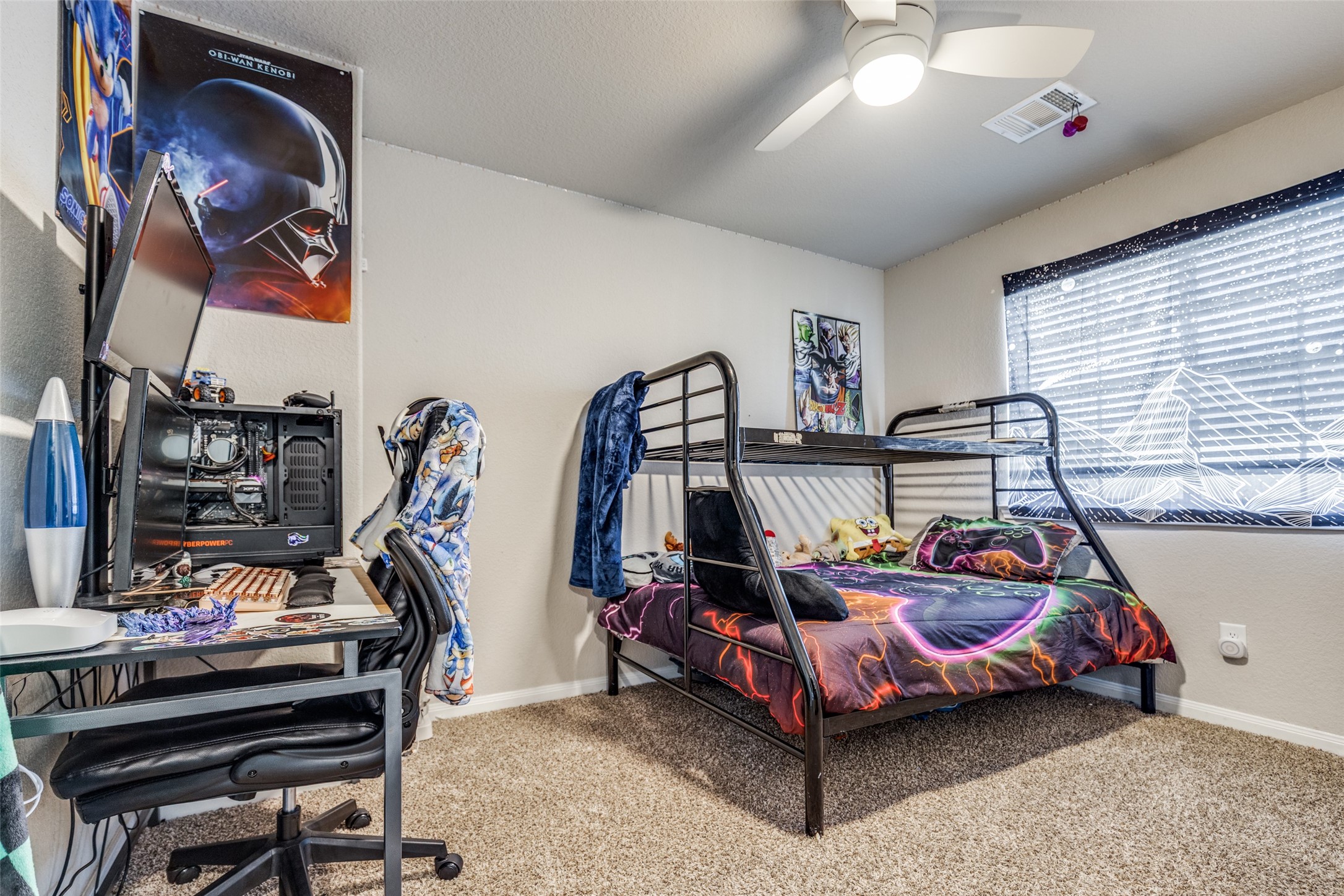 3633 Cub Drive Conroe, TX 77301 - Photo 13 of 30 a bedroom with furniture and a fan