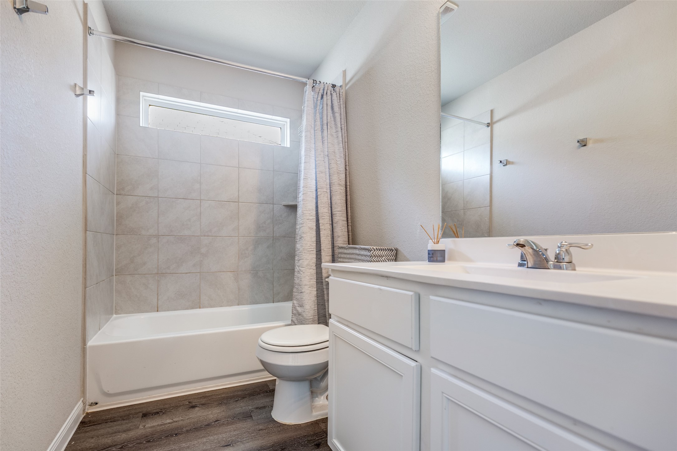 3633 Cub Drive Conroe, TX 77301 - Photo 14 of 30 a bathroom with a bathtub shower sink vanity and toilet