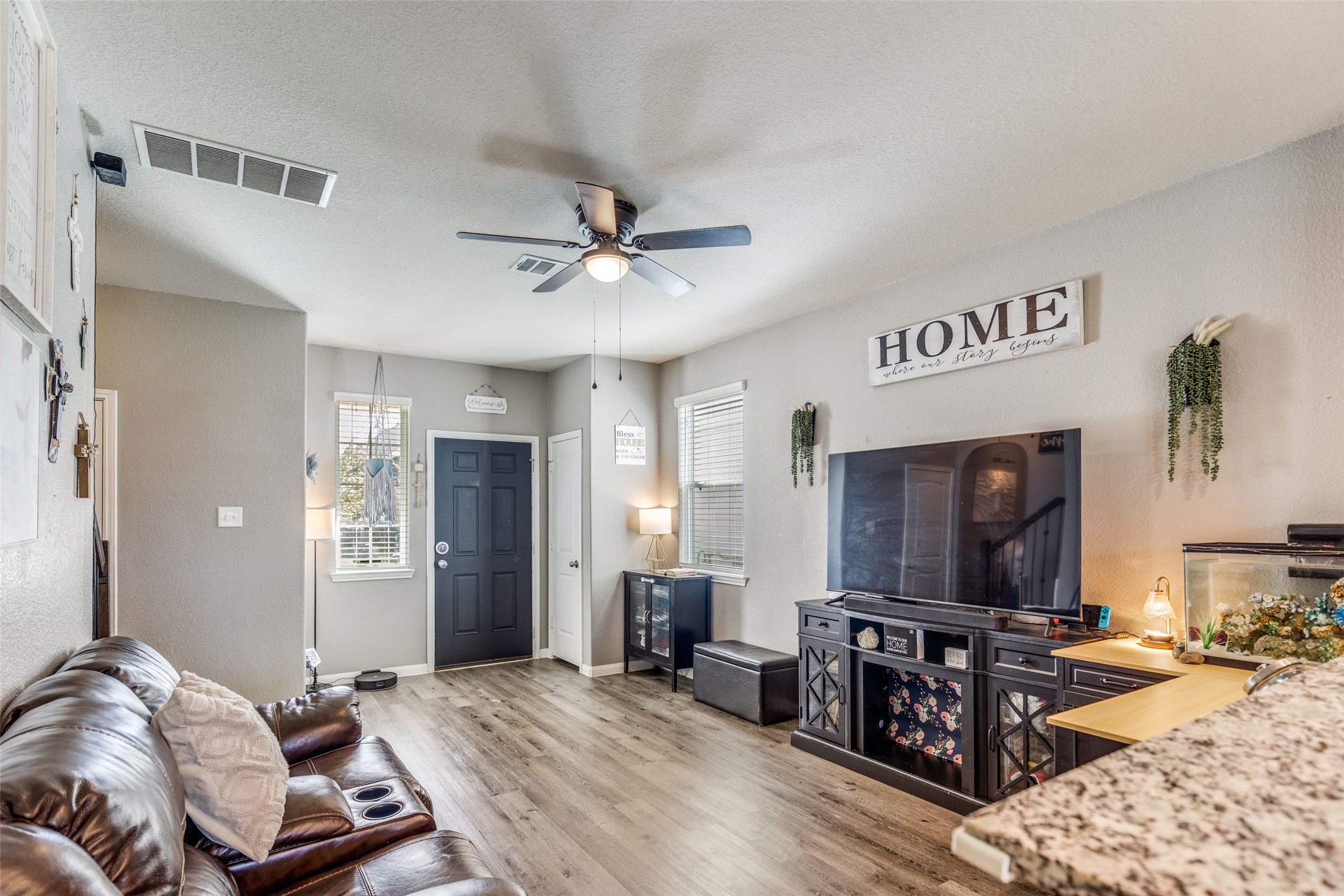 3633 Cub Drive Conroe, TX 77301 - Photo 16 of 30 a living room with furniture and a flat screen tv