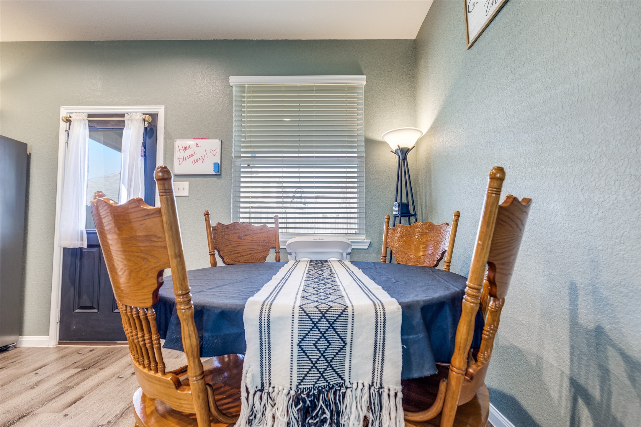 3633 Cub Drive Conroe, TX 77301 - Photo 19 of 30 a view of a dining room with furniture and wooden floor