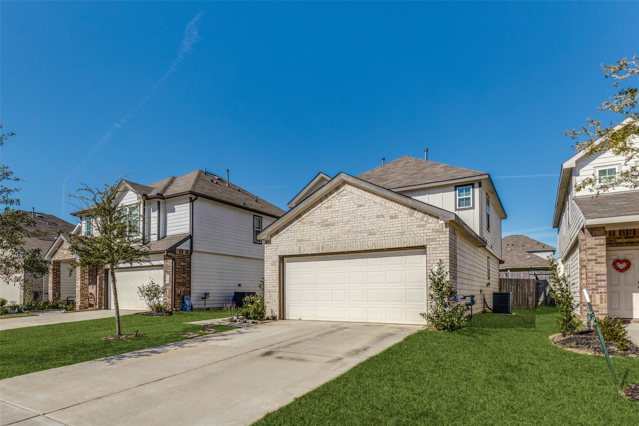 3633 Cub Drive Conroe, TX 77301 - Photo 22 of 30 a front view of a house with a garden and yard