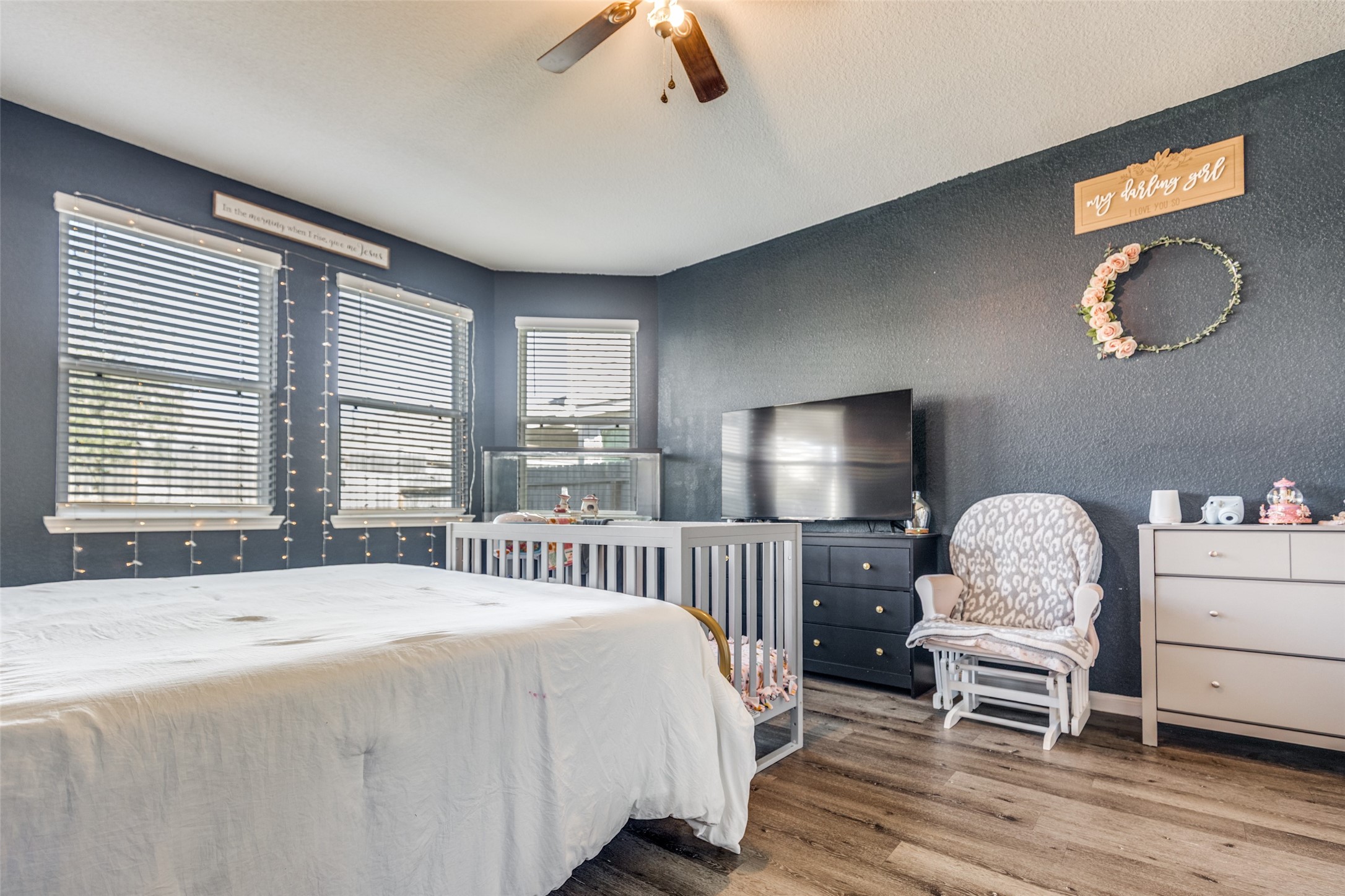 3633 Cub Drive Conroe, TX 77301 - Photo 6 of 30 a bedroom with a bed and a chandelier