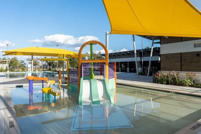 a view of a house with swimming pool