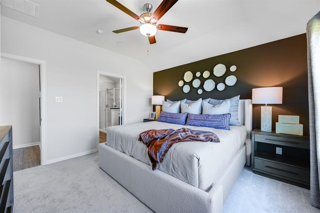 2621 Glacier Road Anna, TX 75409 - Photo 24 of 38 a bedroom with a bed and a lamp on the dresser
