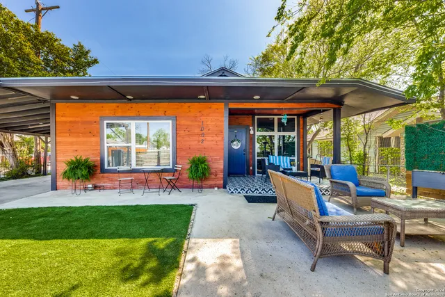 a patio with yard table and chairs