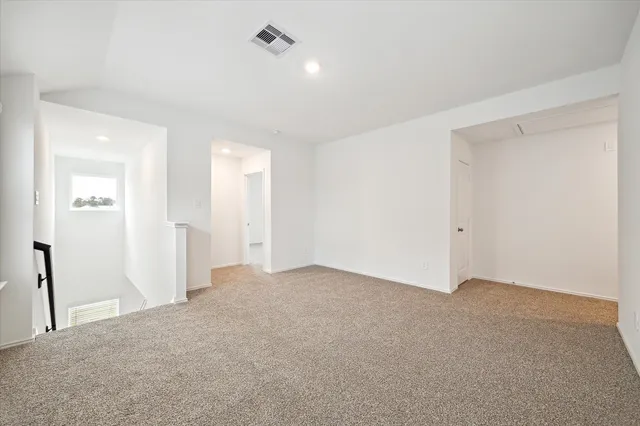 an empty room with a bathroom