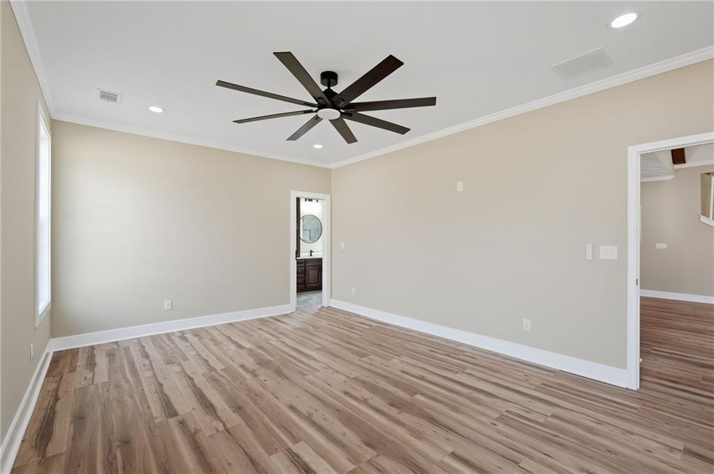 2322 Rockbridge Road Southwest Stone Mountain, GA 30087 - Photo 20 of 46 wooden floor in an empty room with a window