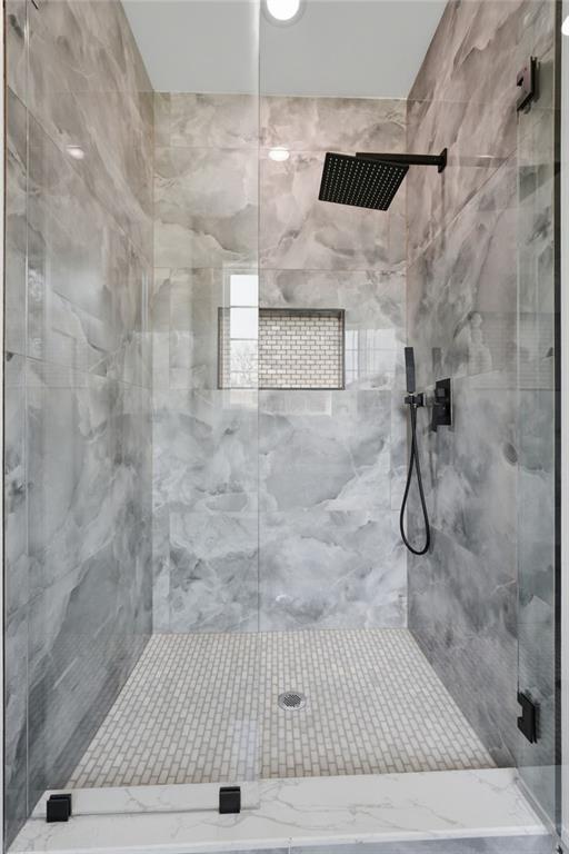 2322 Rockbridge Road Southwest Stone Mountain, GA 30087 - Photo 24 of 46 a bathroom with a shower