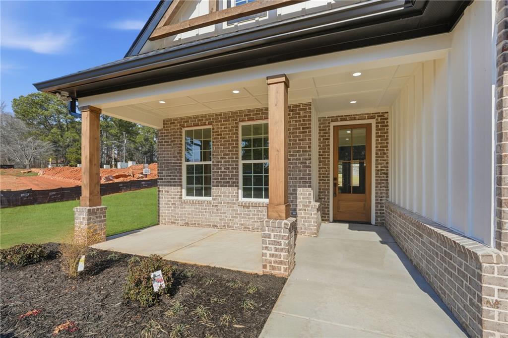 2322 Rockbridge Road Southwest Stone Mountain, GA 30087 - Photo 3 of 46 a front view of a house with a yard