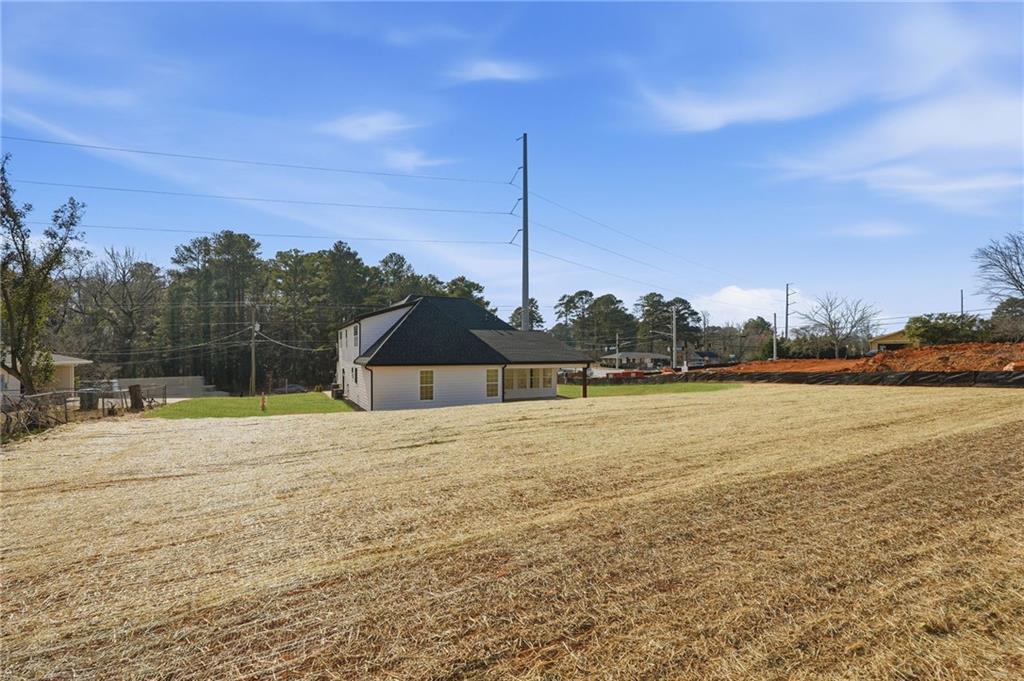 2322 Rockbridge Road Southwest Stone Mountain, GA 30087 - Photo 46 of 46 a house with a lake view