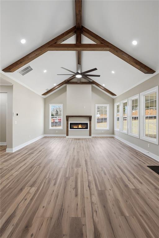 2322 Rockbridge Road Southwest Stone Mountain, GA 30087 - Photo 9 of 46 a view of a livingroom with a hardwood floor and a ceiling fan