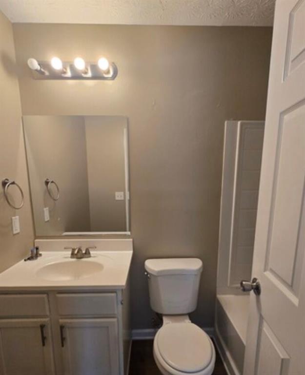 2881 Norfair Loop Lithonia, GA 30038 - Photo 4 of 5 a bathroom with a toilet sink and mirror