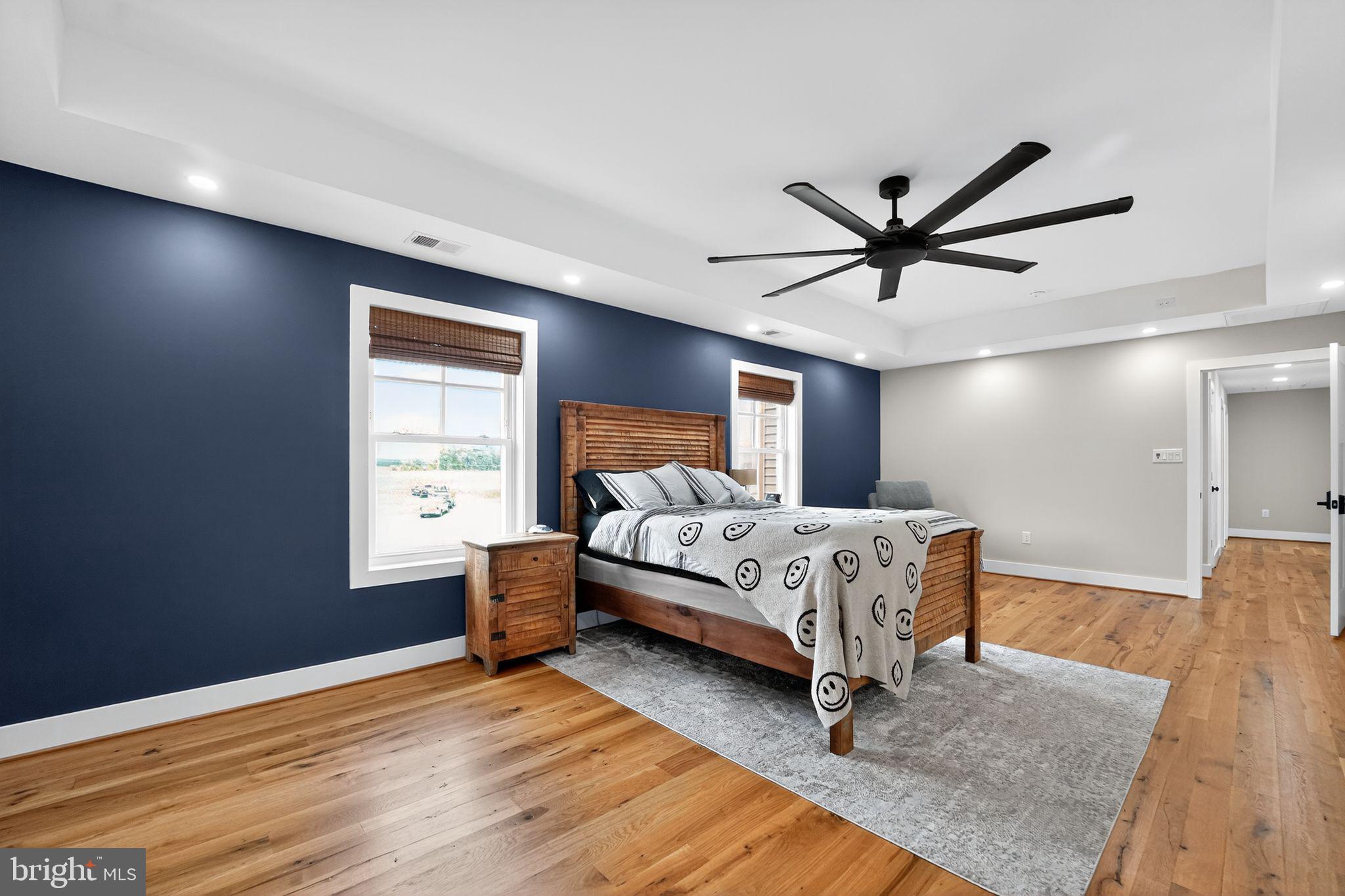 8305 Biggs Ford Road Walkersville, MD 21793 - Photo 17 of 38 a bed sitting in a spacious bedroom next to a window