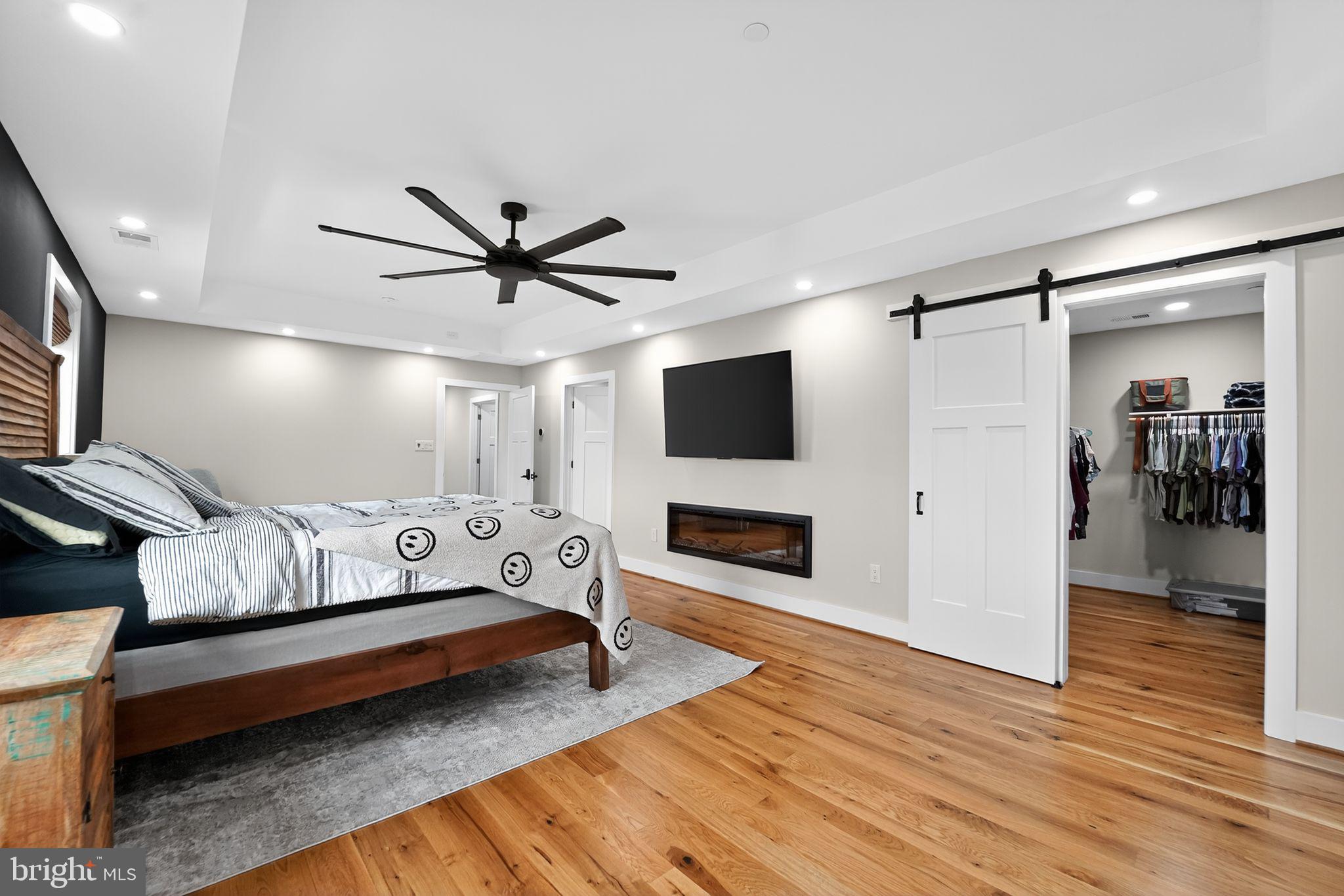 8305 Biggs Ford Road Walkersville, MD 21793 - Photo 18 of 38 a bedroom with furniture and a flat screen tv