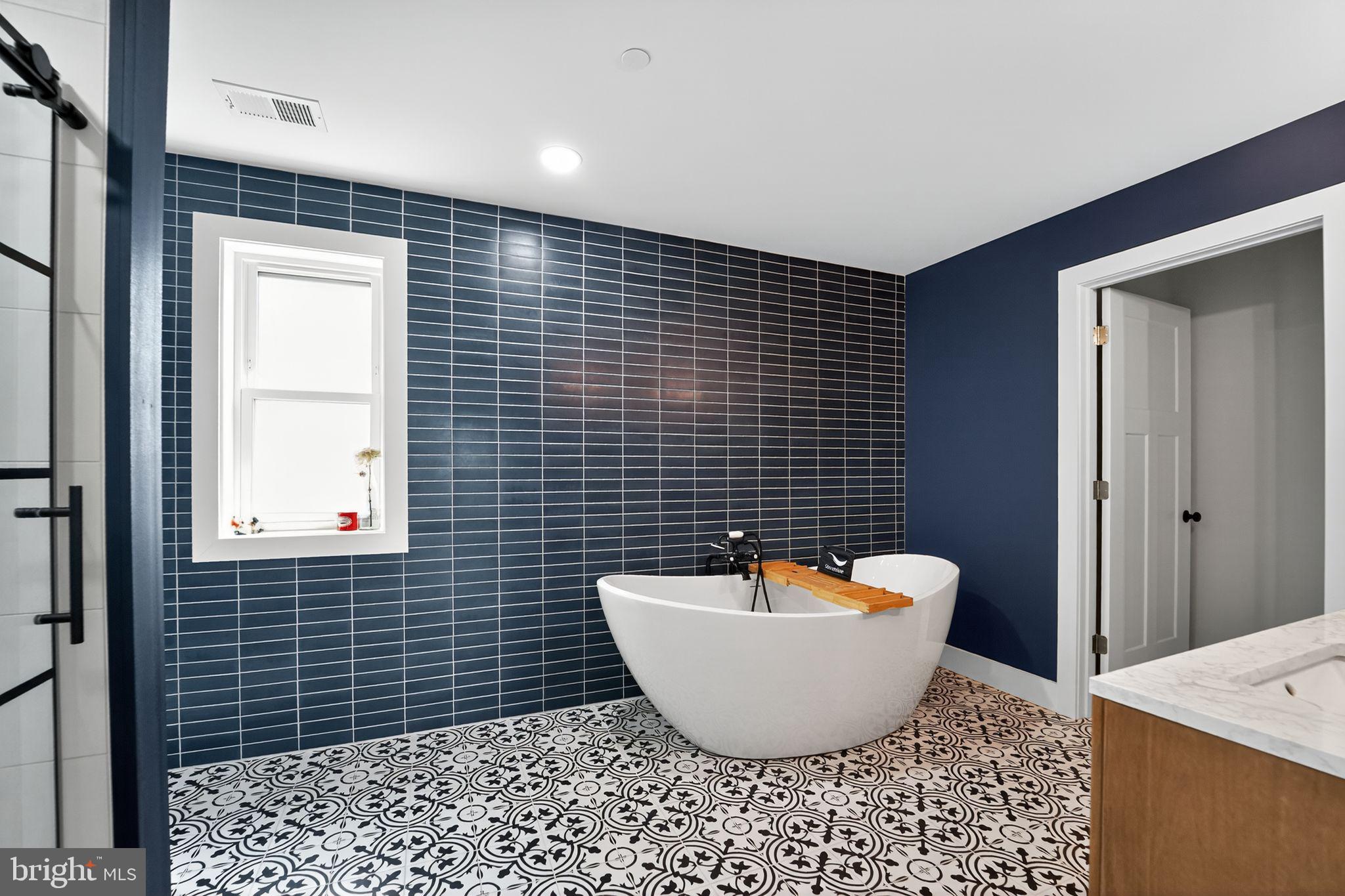 8305 Biggs Ford Road Walkersville, MD 21793 - Photo 20 of 38 a bathroom with a toilet a sink and mirror