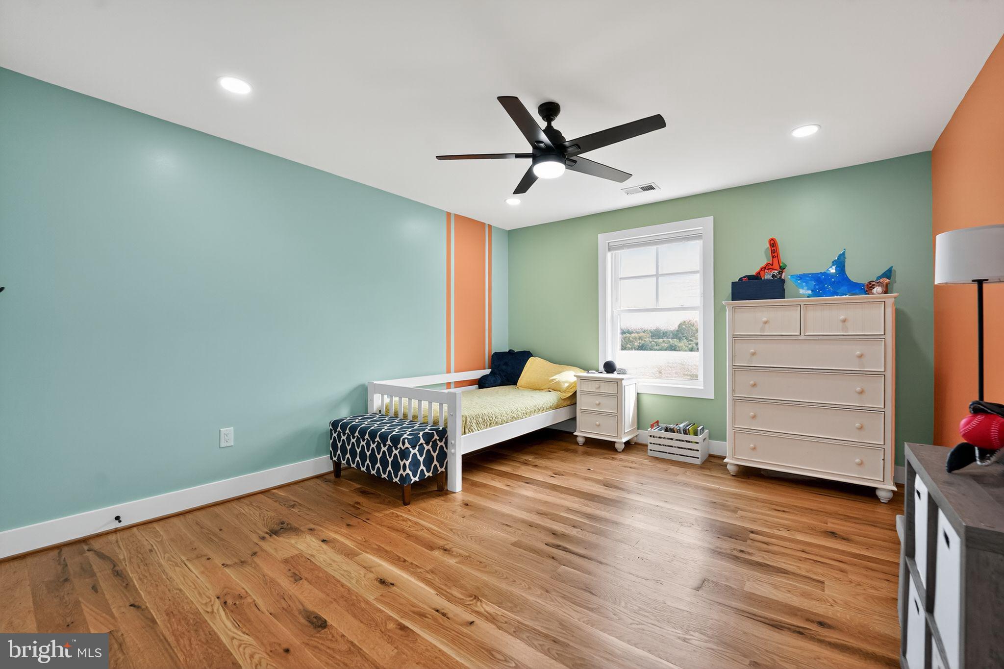 8305 Biggs Ford Road Walkersville, MD 21793 - Photo 22 of 38 a living room with furniture and a wooden floor