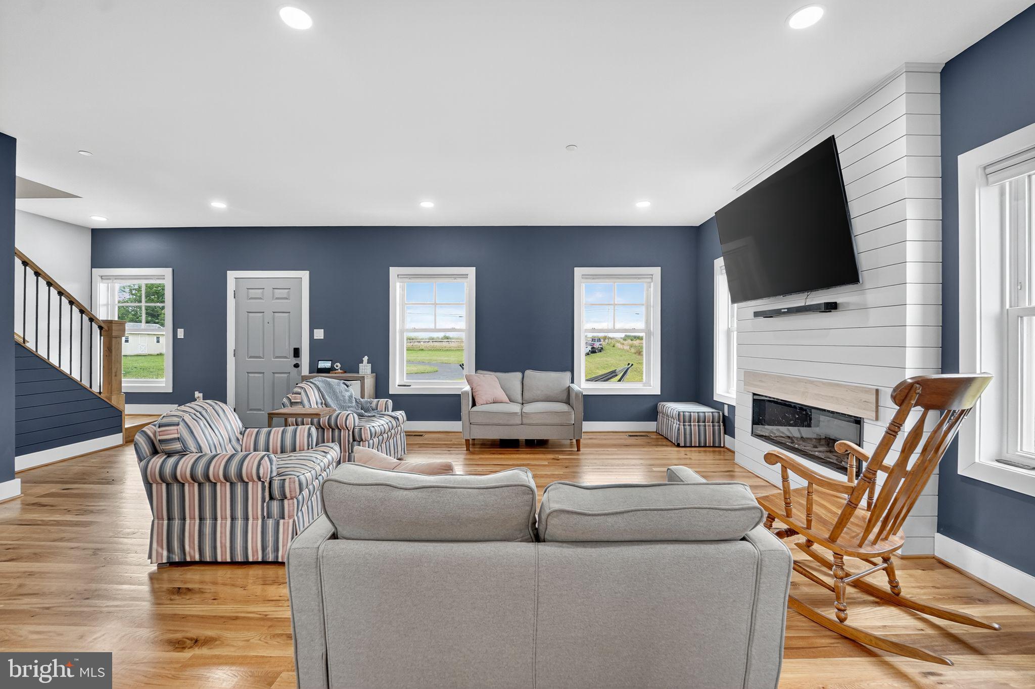 8305 Biggs Ford Road Walkersville, MD 21793 - Photo 5 of 38 a living room with furniture and a flat screen tv