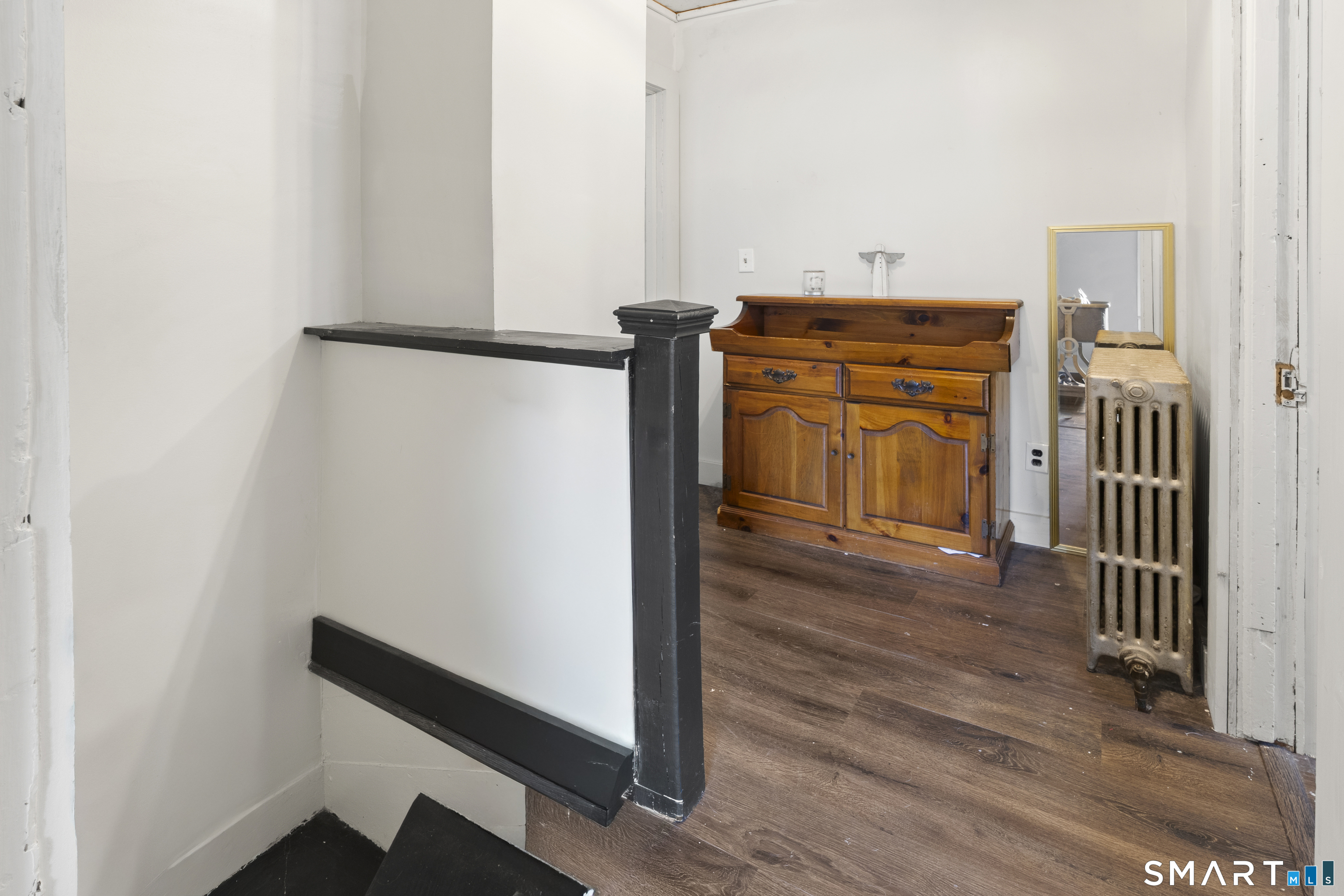 47 Broad Street Killingly, CT 06239 - Photo 21 of 33 a view of a hallway with wooden floor