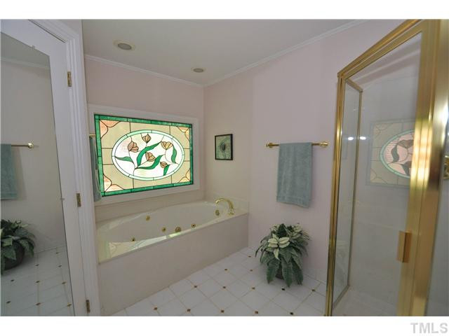 6424 Rushingbrook Drive Raleigh, NC 27612 - Photo 15 of 25 Her full bath with separate shower and garden tub Master Bath/Spa