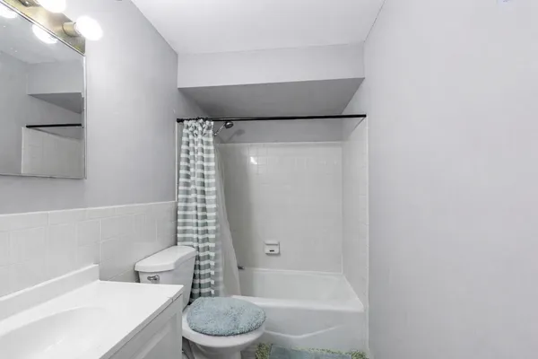 a bathroom with a toilet and a bathtub