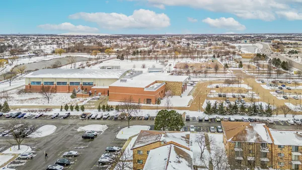 an aerial view of a residential building with lake view