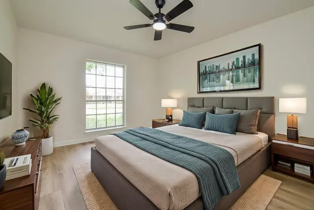 a bedroom with bed and a window