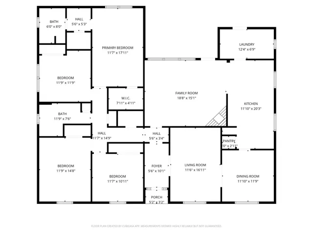 a view of a backyard with couches plants and large trees