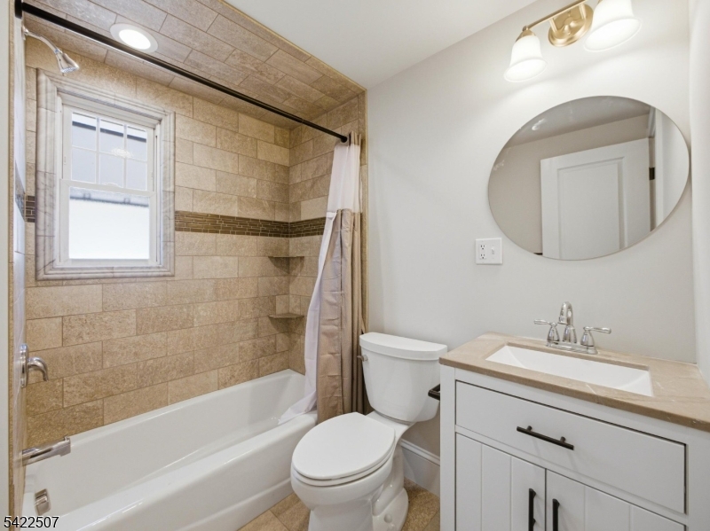 46 West End Avenue, Unit LEFT Summit, NJ 07901 - Photo 15 of 19 a bathroom with a sink toilet and shower