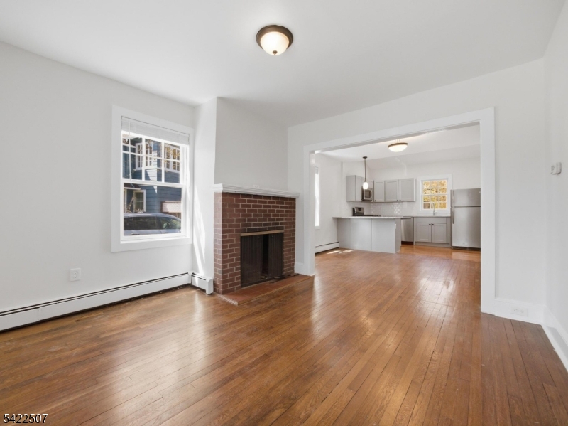 46 West End Avenue, Unit LEFT Summit, NJ 07901 - Photo 4 of 19 a view of kitchen and hall with wooden floor