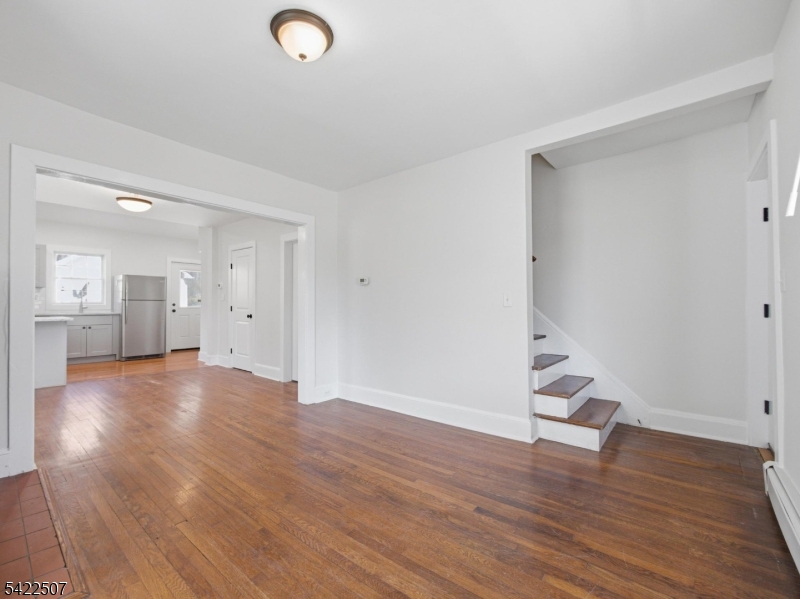 46 West End Avenue, Unit LEFT Summit, NJ 07901 - Photo 5 of 19 a view of empty room with wooden floor