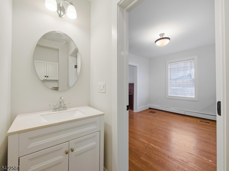 46 West End Avenue, Unit LEFT Summit, NJ 07901 - Photo 6 of 19 a bathroom with a sink and a mirror