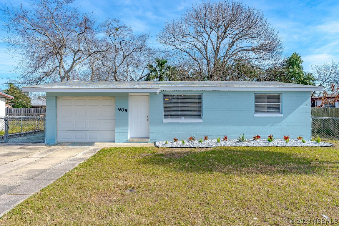 909 Derbyshire Road Daytona Beach, FL 32117 - Photo 17 of 18 a front view of house with yard