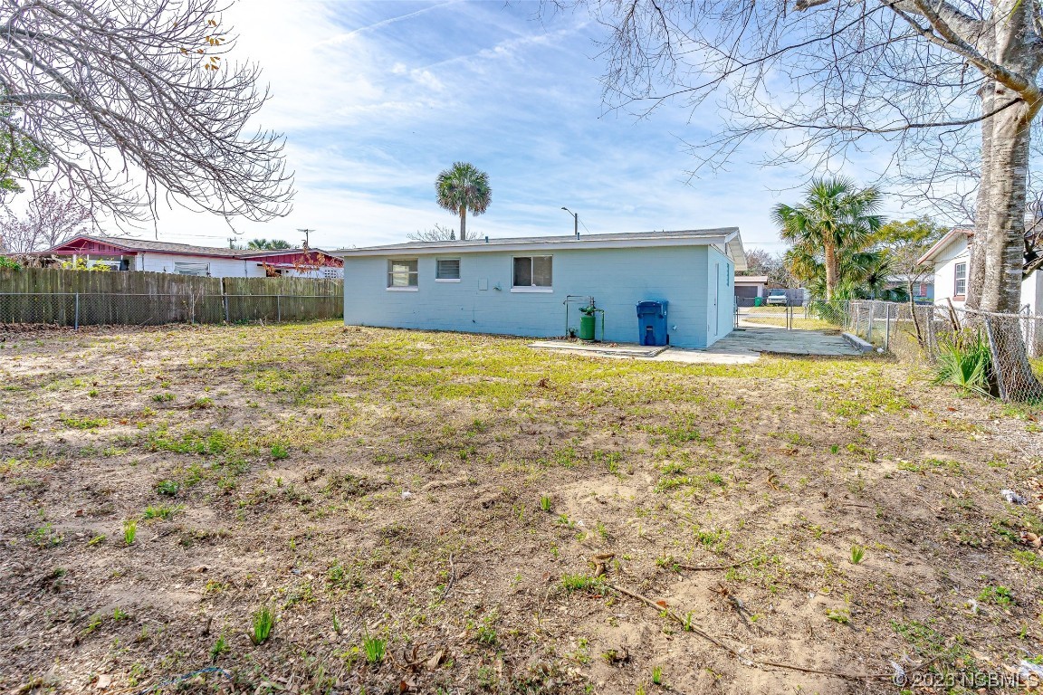 909 Derbyshire Road Daytona Beach, FL 32117 - Photo 4 of 18 a view of a house with a yard