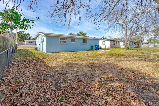 a kitchen with stainless steel appliances granite countertop a stove a sink and white cabinets