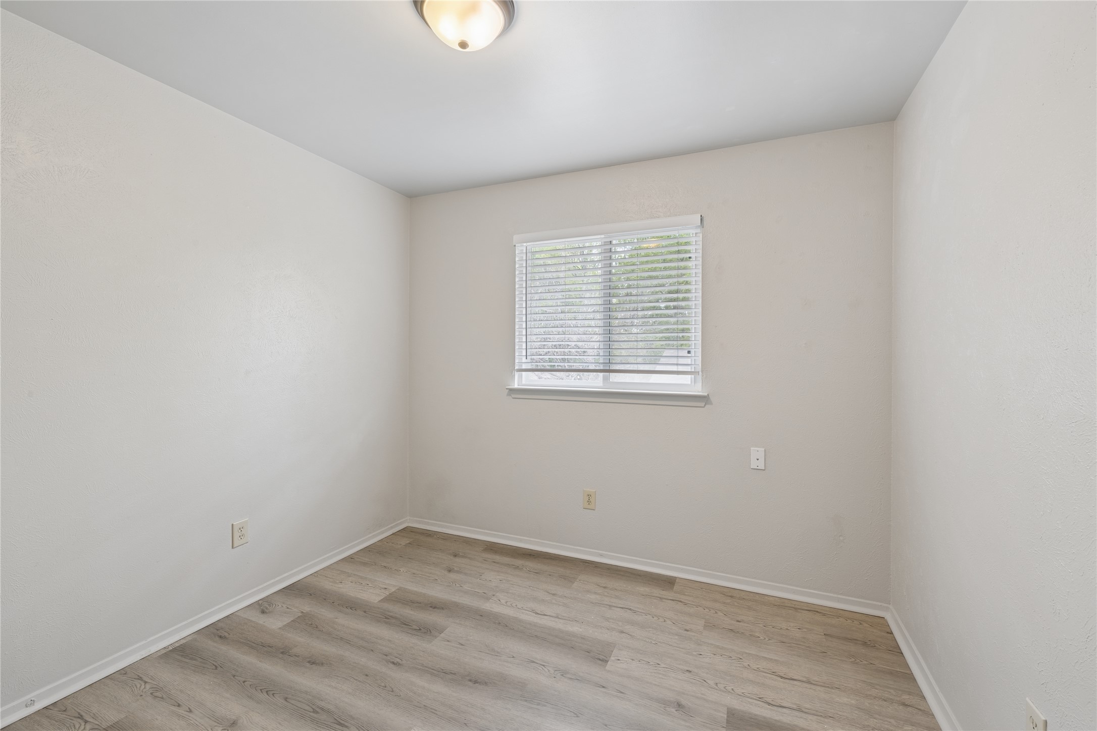 820 Sahara Avenue, Unit B Austin, TX 78745 - Photo 10 of 29 an empty room with a window