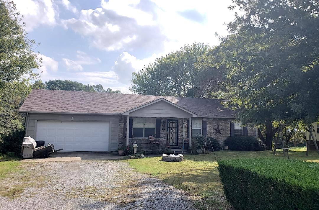 634 Butler Road Portland, TN 37148 - Photo 1 of 14 a view of a house with swimming pool and a yard