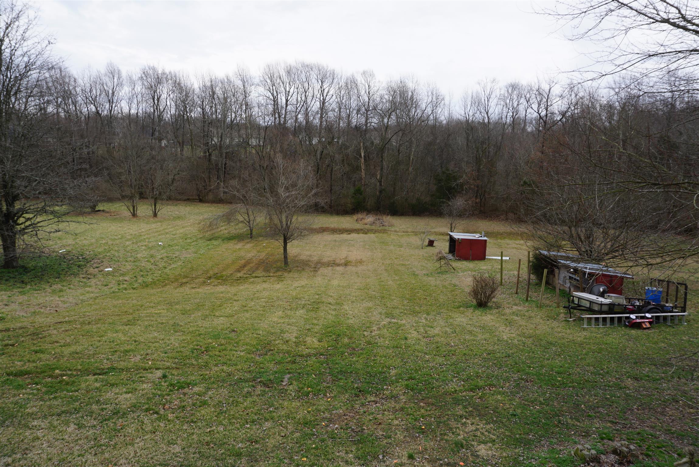 634 Butler Road Portland, TN 37148 - Photo 13 of 14 a ground with lots of green space and trees