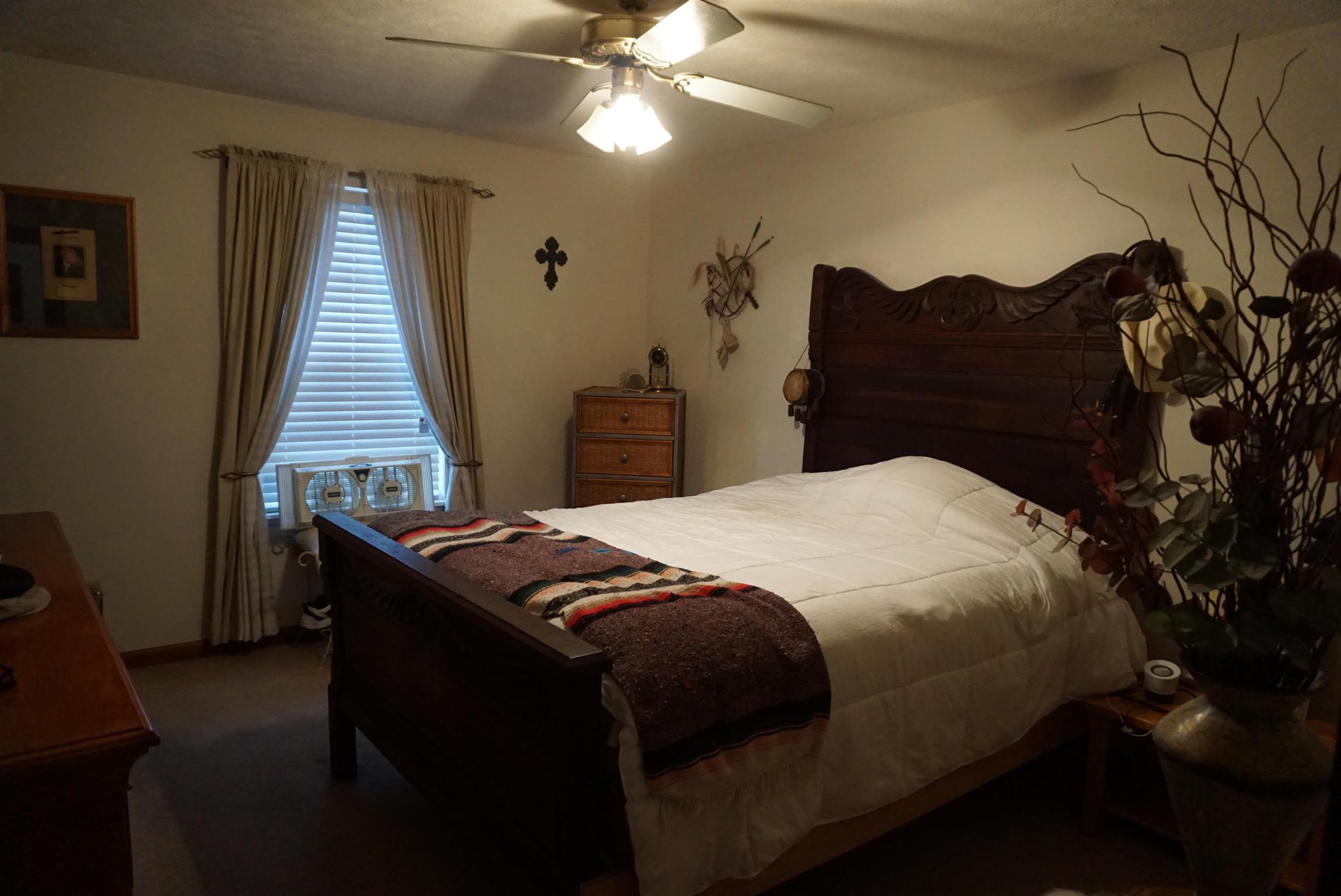 634 Butler Road Portland, TN 37148 - Photo 6 of 14 a bedroom with a bed and a chandelier