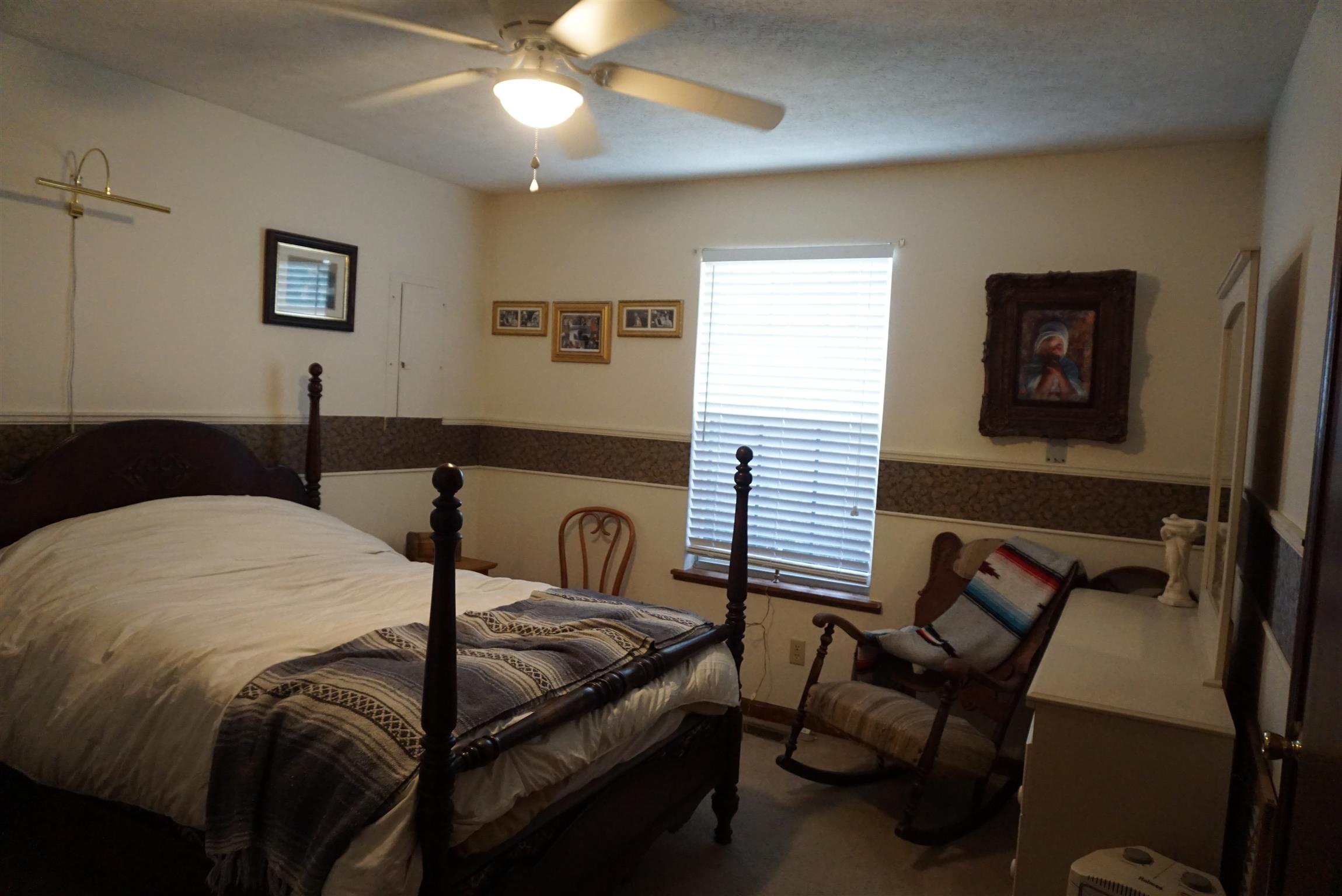 634 Butler Road Portland, TN 37148 - Photo 8 of 14 a bedroom with a bed and wooden floor