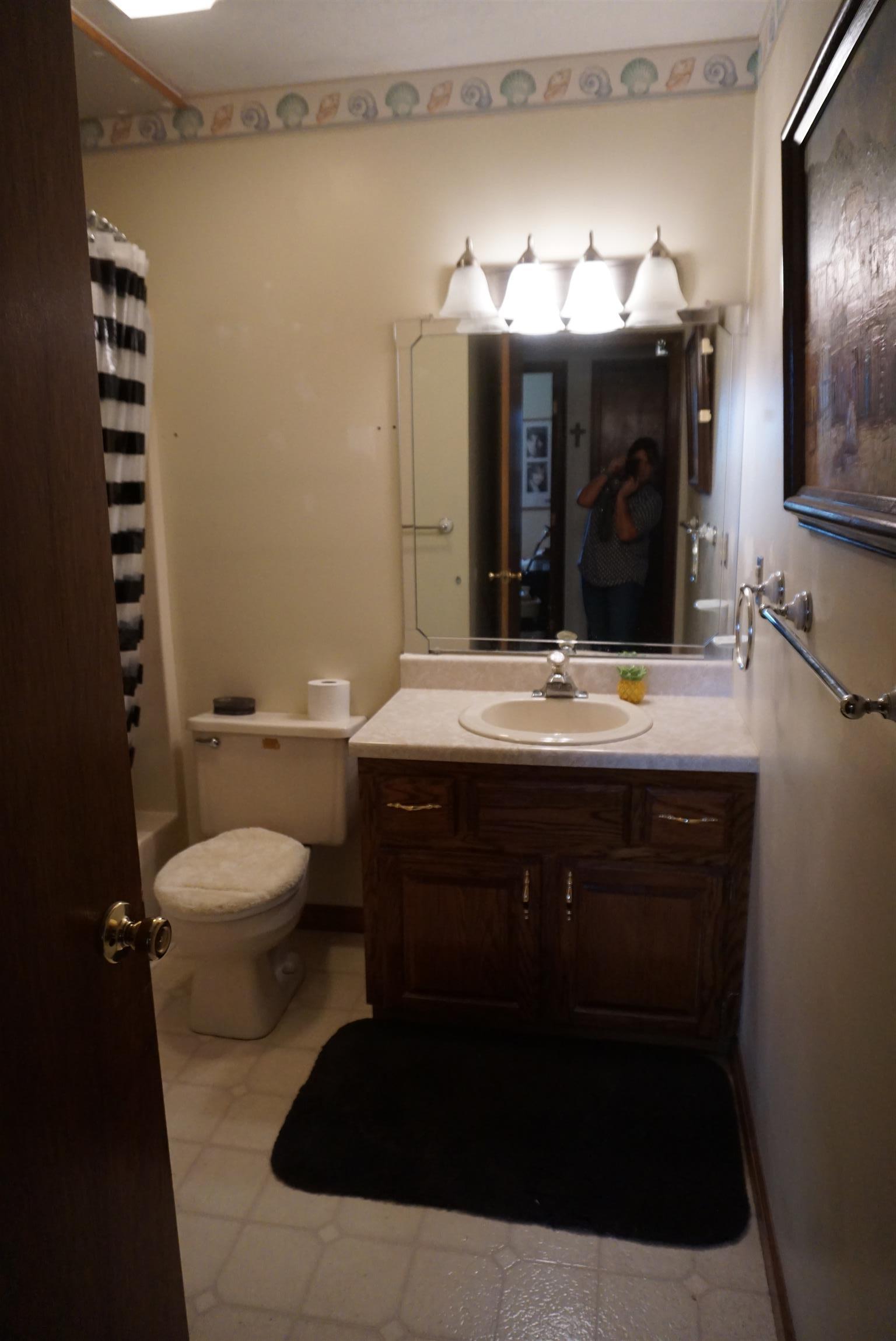 634 Butler Road Portland, TN 37148 - Photo 9 of 14 a bathroom with a sink and a mirror