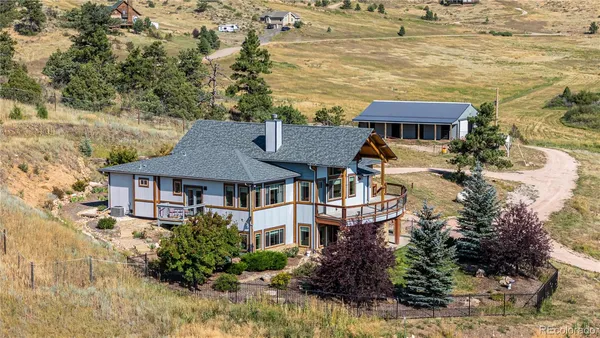 a aerial view of a house with a yard