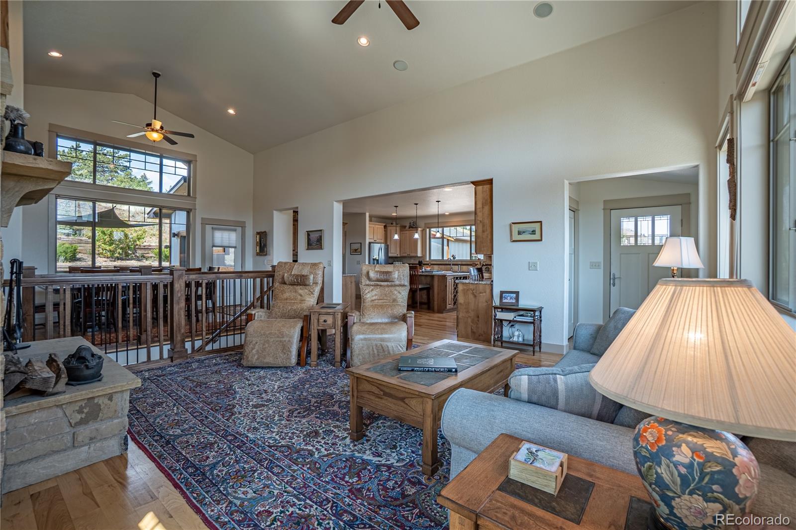 1388 Mt Moriah Road Livermore, CO 80536 - Photo 13 of 40 a living room with furniture and wooden floor