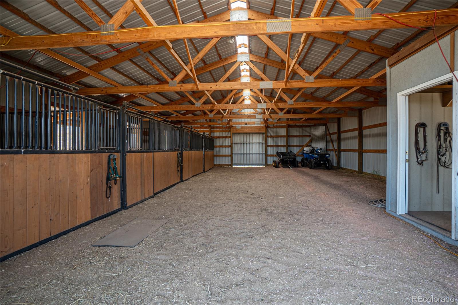 1388 Mt Moriah Road Livermore, CO 80536 - Photo 32 of 40 a view of a empty room with wooden walls
