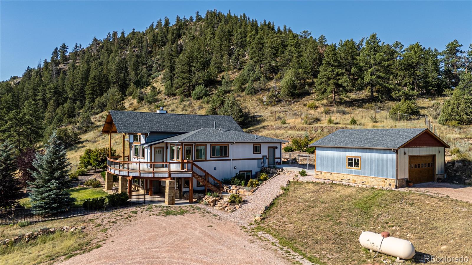 1388 Mt Moriah Road Livermore, CO 80536 - Photo 7 of 40 front view of a house with a yard