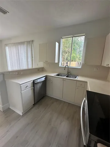 a view of two chairs in the balcony